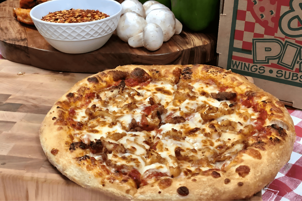 manny and olgas pizza made with mozzarella cheese givinzg it the perfect taste