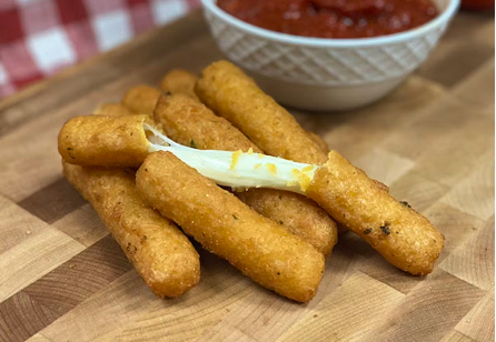 Golden mozzarella sticks Golden mozzarella sticks with marinara dip, a popular catering appetizer.