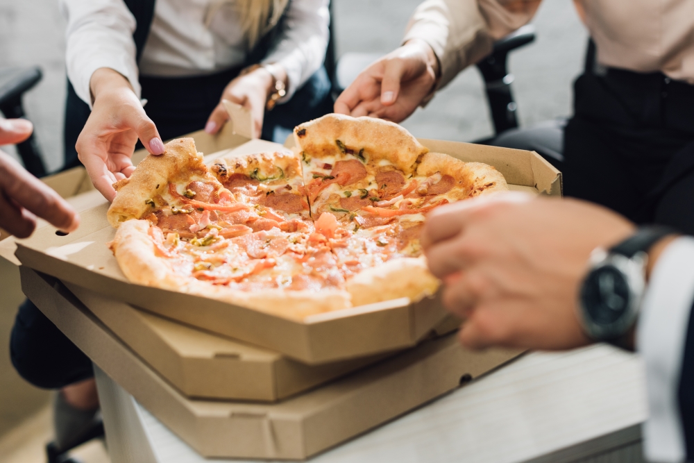 pizza at corporate event being shared