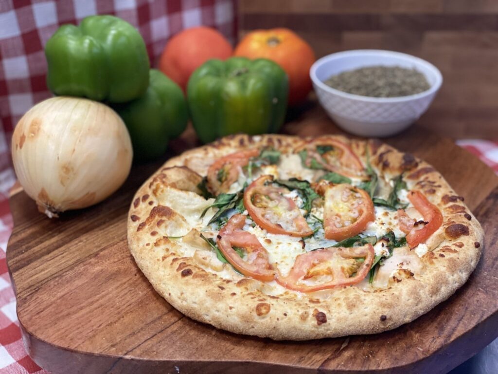 A cheesy pizza ready for your pizza and wings feast. A cheesy pizza ready for your pizza and wings feast.