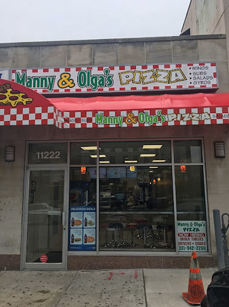 Manny & Olga’s Wheaton storefront with red awning and signage welcoming customers.