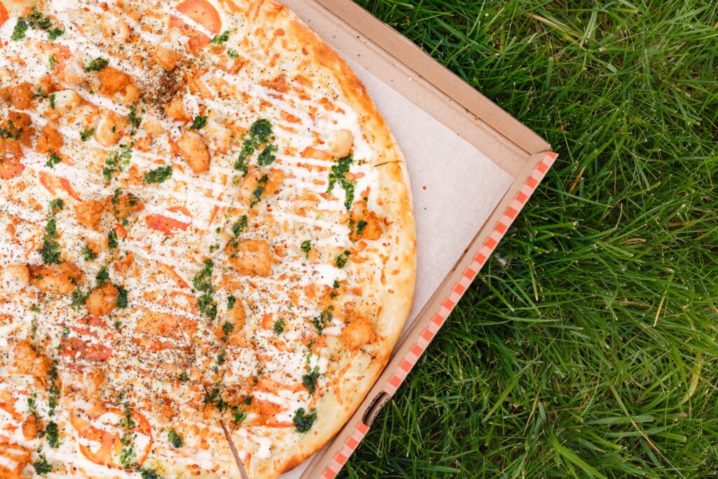 A pizza served fresh, ideal for springtime picnics and cherry blossom events.