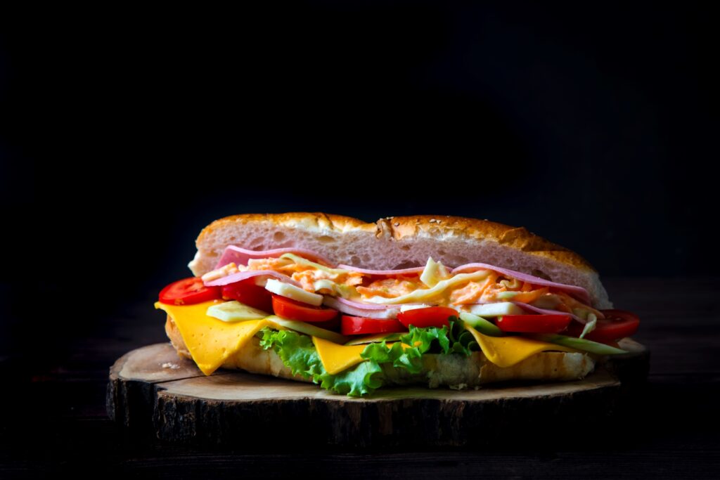 Delicious cold sandwich served with coleslaw sauce.