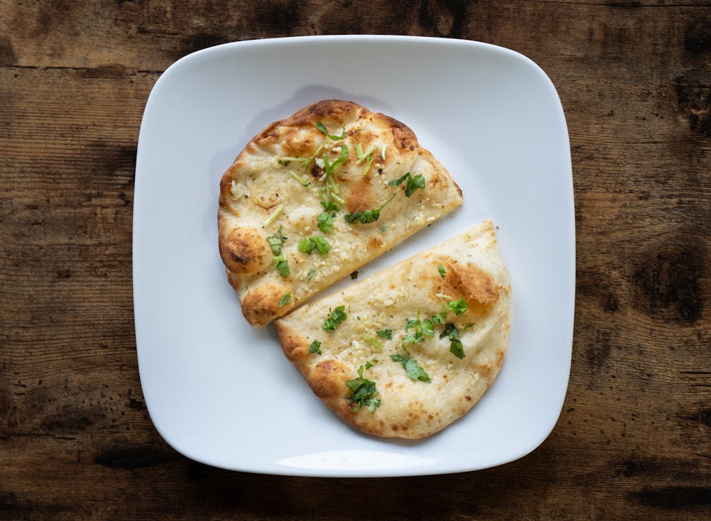 A flat-lay shot of garlic bread with a cheese filling.