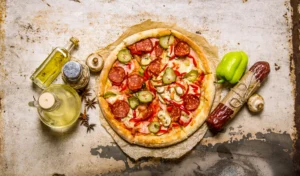 Shot of a delicious topping-rich pizza with salami, peppers, and mushrooms.