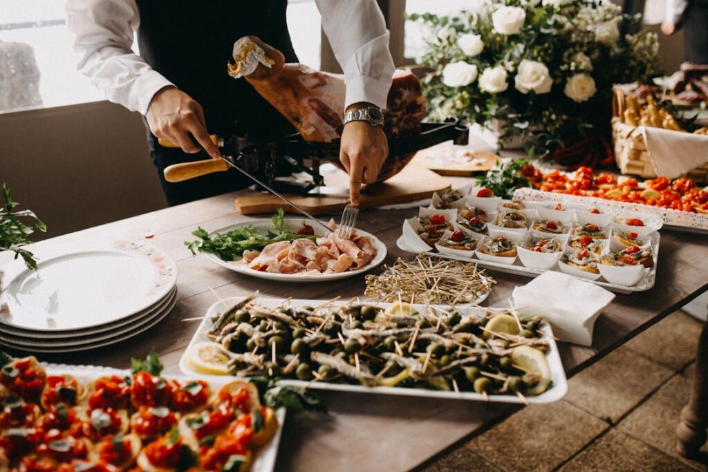 Caterer setting up a formal dining table, representing structured event preparation and service flow.