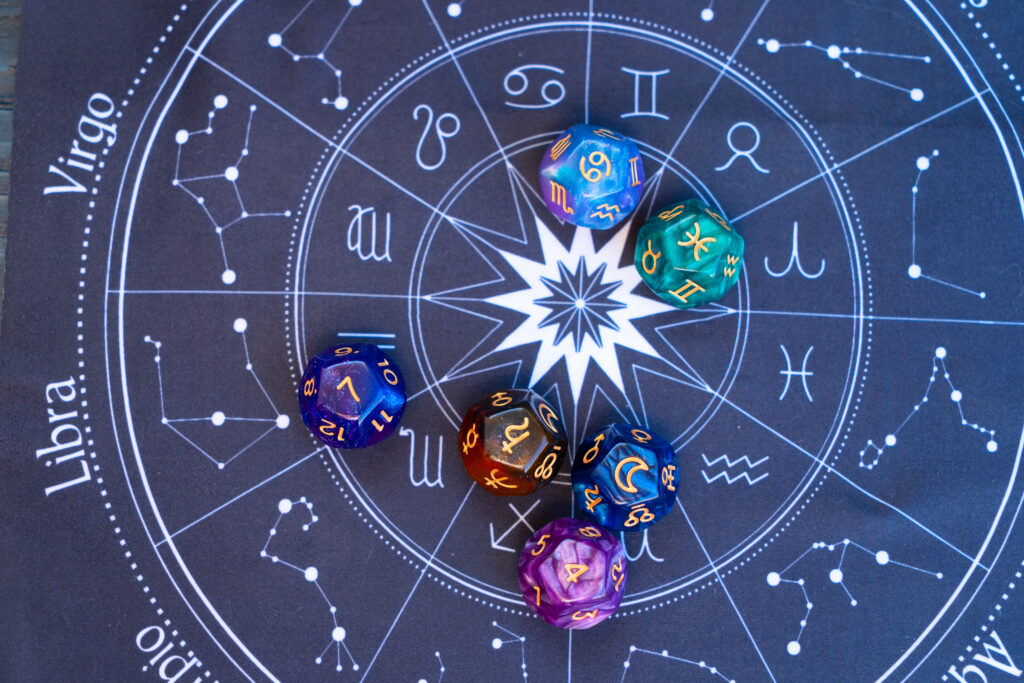 Zodiac dice on star chart background blending cosmic astrology with Manny and Olga’s pizza horoscope theme.