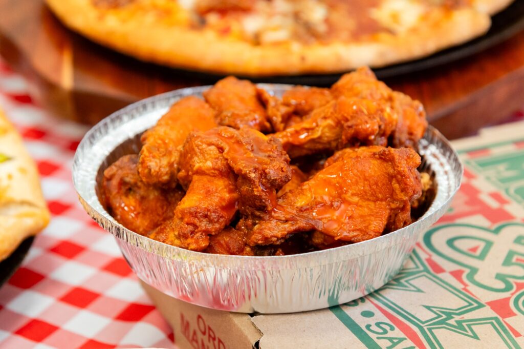 Hot and crispy buffalo wings from Manny & Olga’s Pizza, perfect for delivery near NIH and Walter Reed in Bethesda.