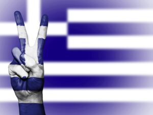 Peace sign against the Greek Flag.