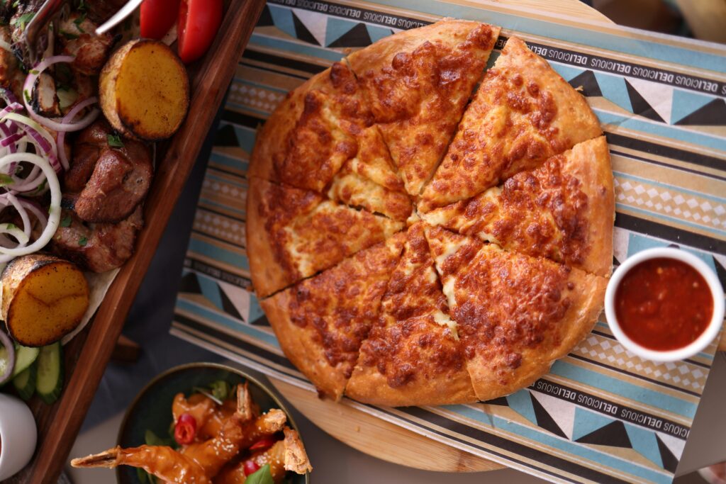 Flat-lay shot of pizza with dip.