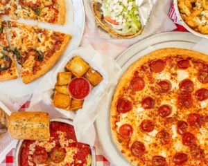 Manny & Olga’s spread with pepperoni pizza, specialty pizza, gyro, toasted ravioli, and pasta.